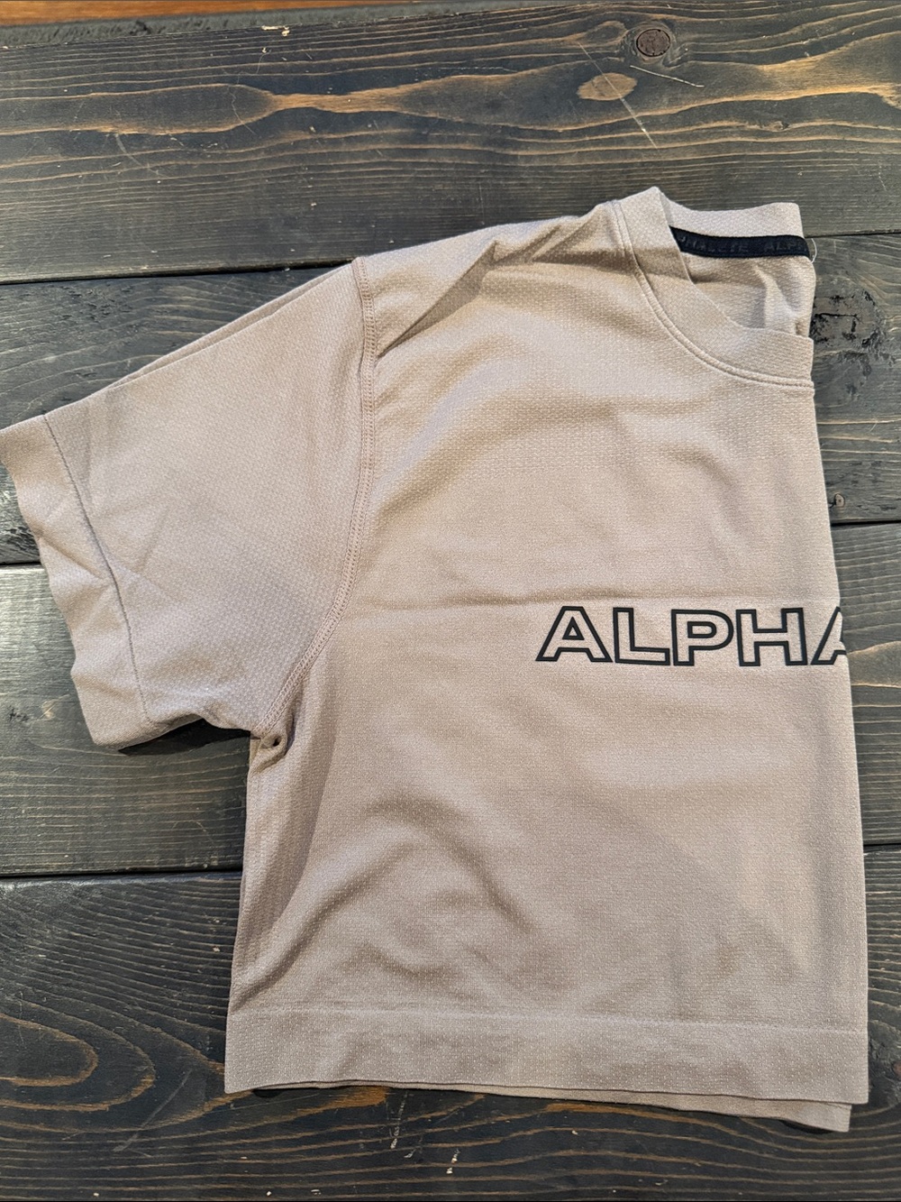 Alphalete Kids Short-Sleeve Tee in Tan with Black Logo